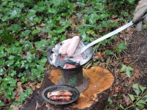 Ladle-charcoal-pot-cooking-sausages